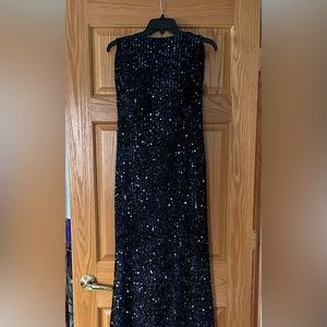 Beautiful formal gown with navy blue sequins, low-cut scooped back& short train.